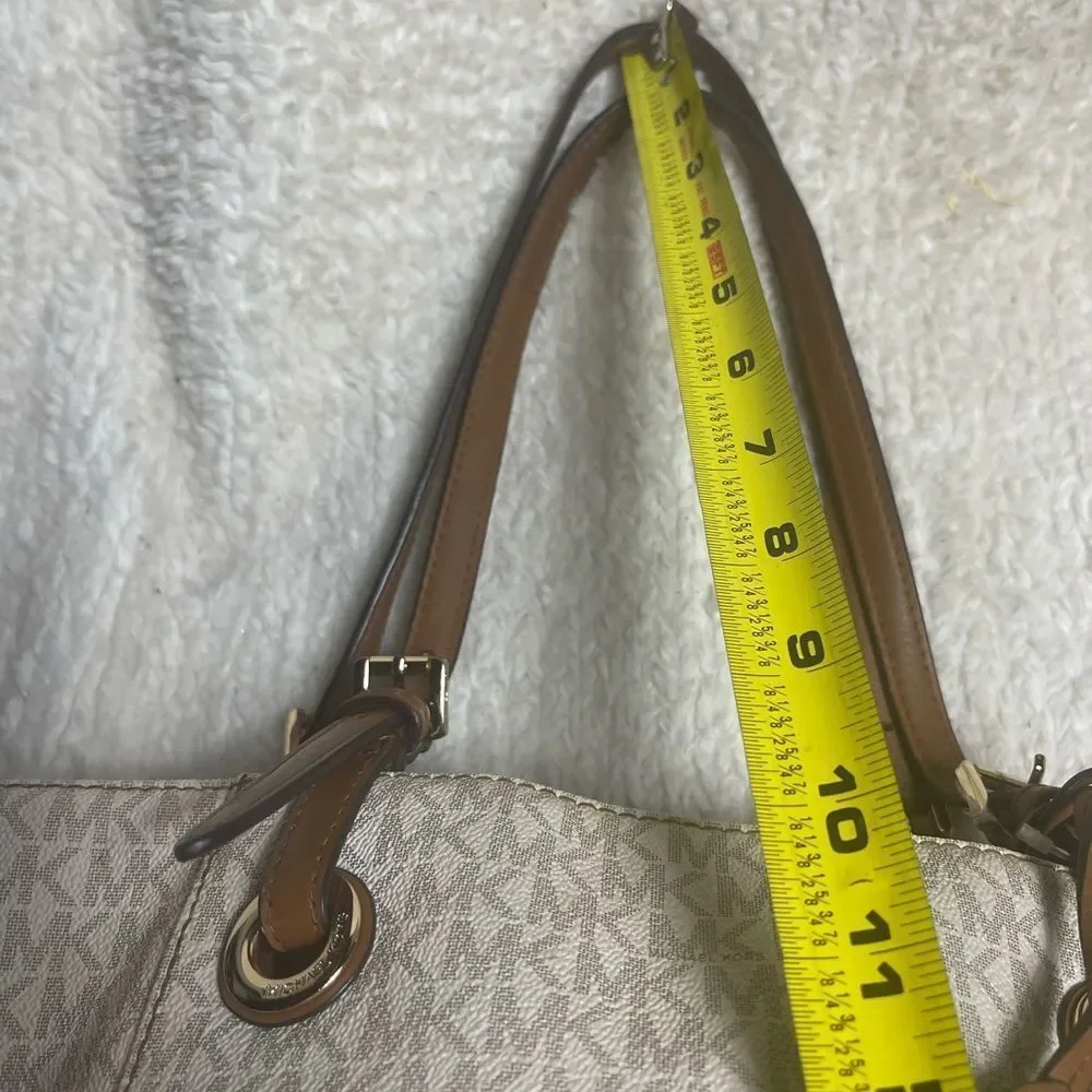 Michael Kors Beige signature Coated Canvas tote , tan leather straps .